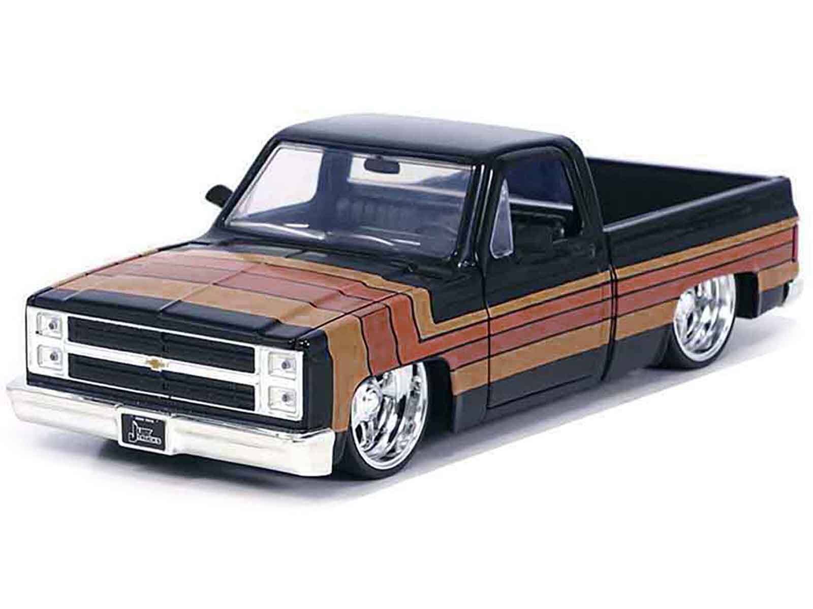 Angle. Jada - 1985 Chevrolet C-10 Pickup Truck Black with Stripes and Paradox Wheels "Just Trucks" Series 1/24 - Black.
