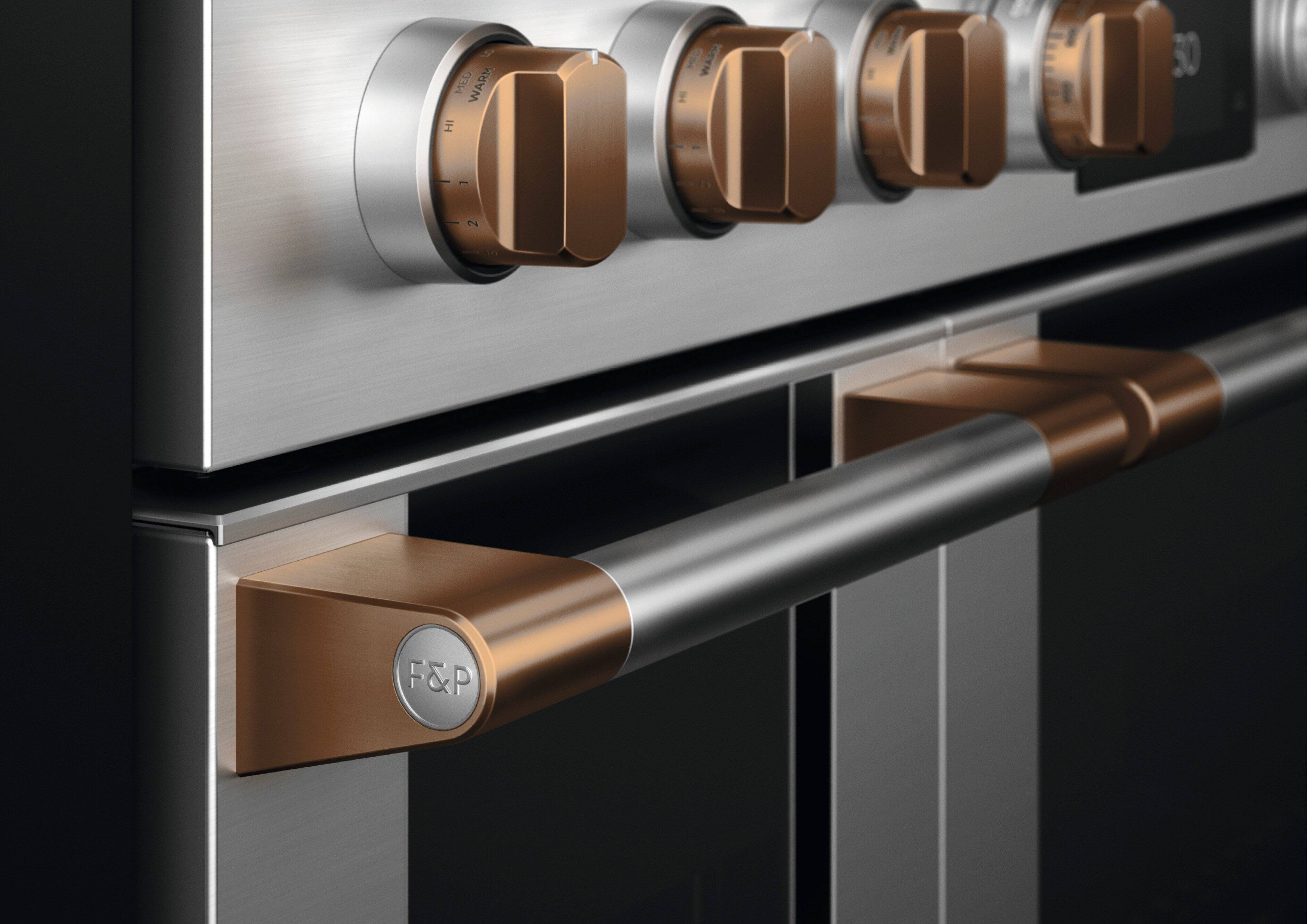 The text on the image reads "9 MED WARM 50 - 1 2 ... F&P." This text is likely a description or instructions for the oven's temperature settings. The numbers "9," "1," and "2" likely represent the temperature settings in degrees Celsius, while "MED WARM" could be a description of the heating mode. The "F&P" could be a brand name or a reference to the oven's features.