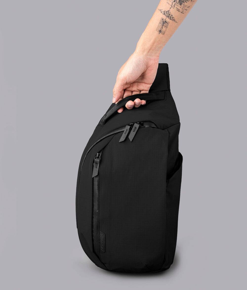 Left. ALPAKA - Metro Crossbody Right Shoulder Sling Bag Men,Sling Backpack - Fits 11" Tablet - Single Shoulder - Black Axoflux 210D.