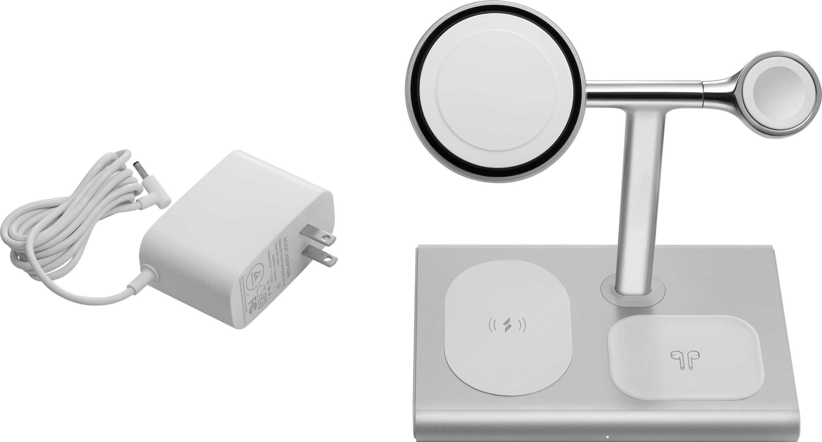 The image shows a white power adapter and a silver fan with a mirror on it. The fan is mounted on a wall, and the power adapter is placed next to it. The fan is designed to be used in the bathroom, providing a convenient and efficient way to dry hands or face. The mirror on the fan allows for easy visibility while using it.