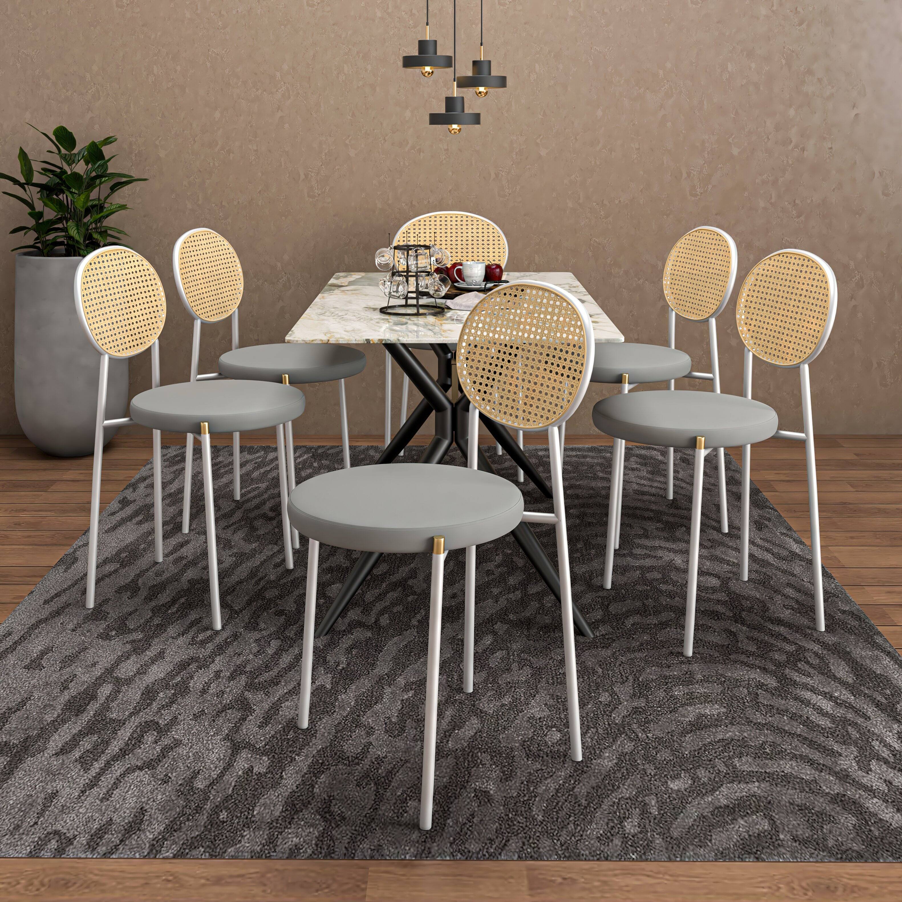 Angle. LeisureMod - Euston Modern Dining Chair with Stainless Steel Frame, Breathable Rattan Backrest & Velvet Seat - Grey.