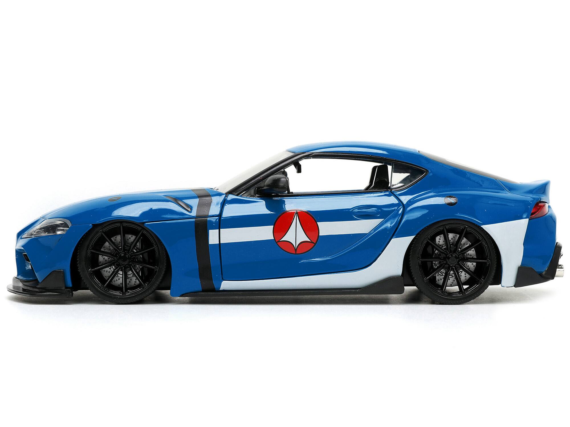 Alt View 2. Jada - 2020 Toyota Supra Blue w/Graphics & Max Sterling Figurine "Robotech" "Hollywood Rides" Series 1/24 Model Car by Jada.