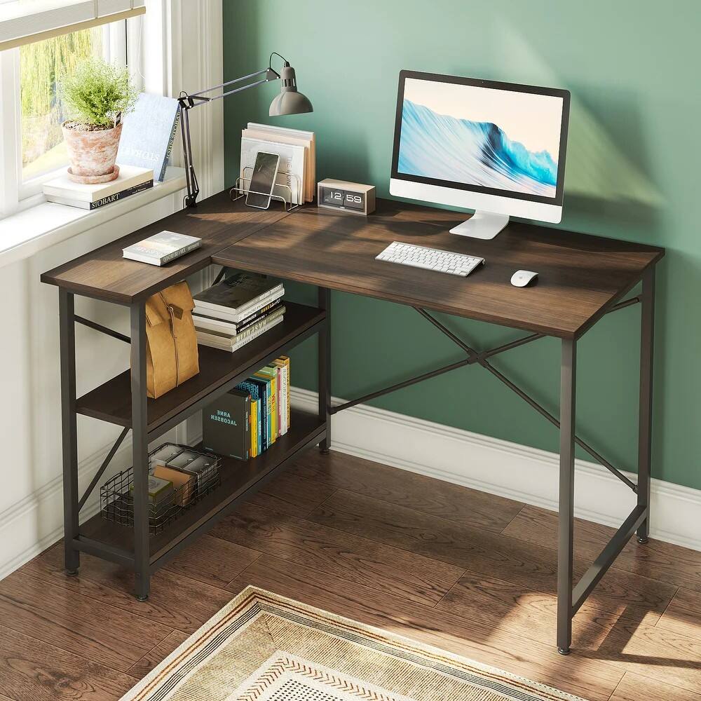 I cannot group or correct the text as it does not appear to be related to the image. The image shows a desk with a computer, keyboard, mouse, and books on it. The desk is placed in front of a window, and there is a potted plant nearby.