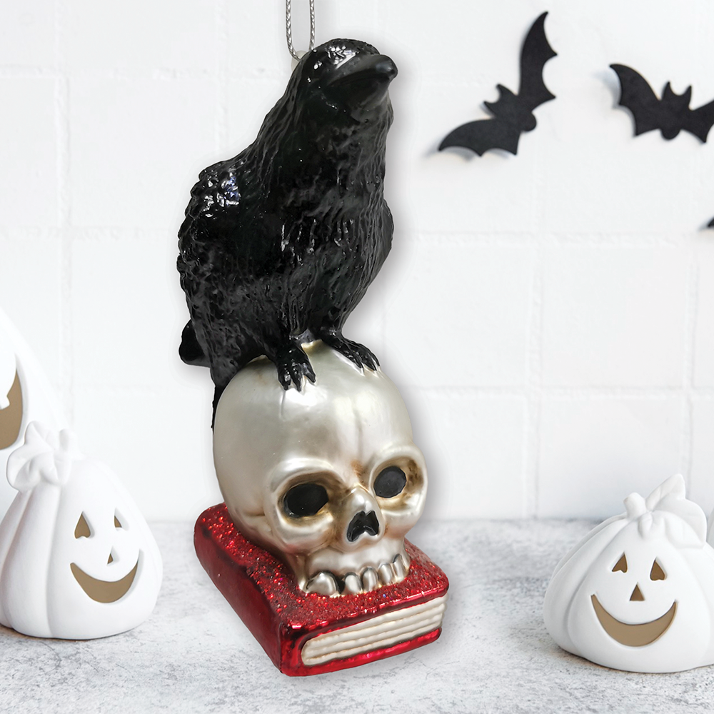 Left. OrnamentallyYou - Raven on Skull and Book Glass Ornament Horror Edgar Allan Poe Decoration - Multi-colored.