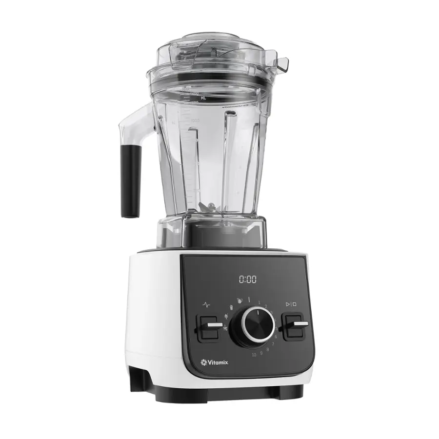 The image features a Vitamix blender with a clear container. The blender is white and black in color, and it is placed on a counter. The blender is turned on, and the container is filled with ingredients. The blender is designed to blend ingredients quickly and efficiently, making it a popular choice for smoothies, soups, and other blended recipes.