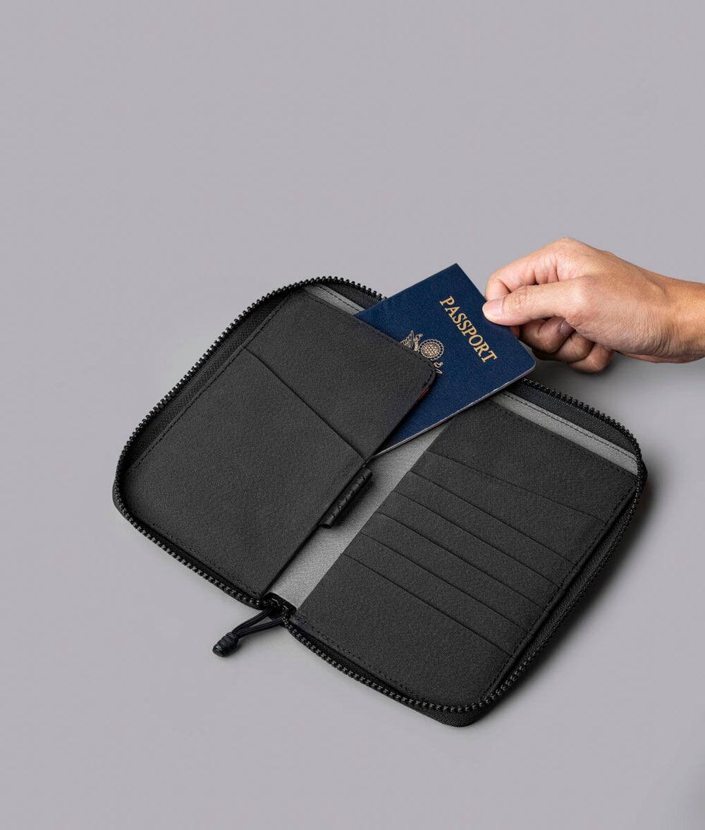 Alt View 1. ALPAKA - RFID Zip Passport Wallet with Boarding Pass Pocket, 7 Card Slots, Magnetic Flaps, Detachable Hand Strap - Black Axogrid 300D.