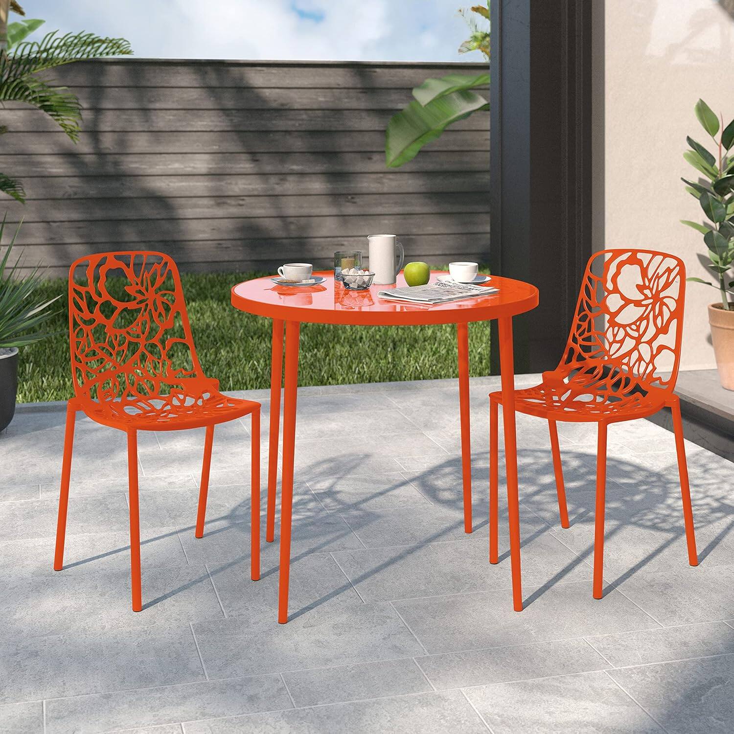 Angle. LeisureMod - Devon (Set of 2) Aluminum Outdoor Dining Chair, UV Resistant & Stackable Floral Design Accent Chair - Fully Assembled - Orange.