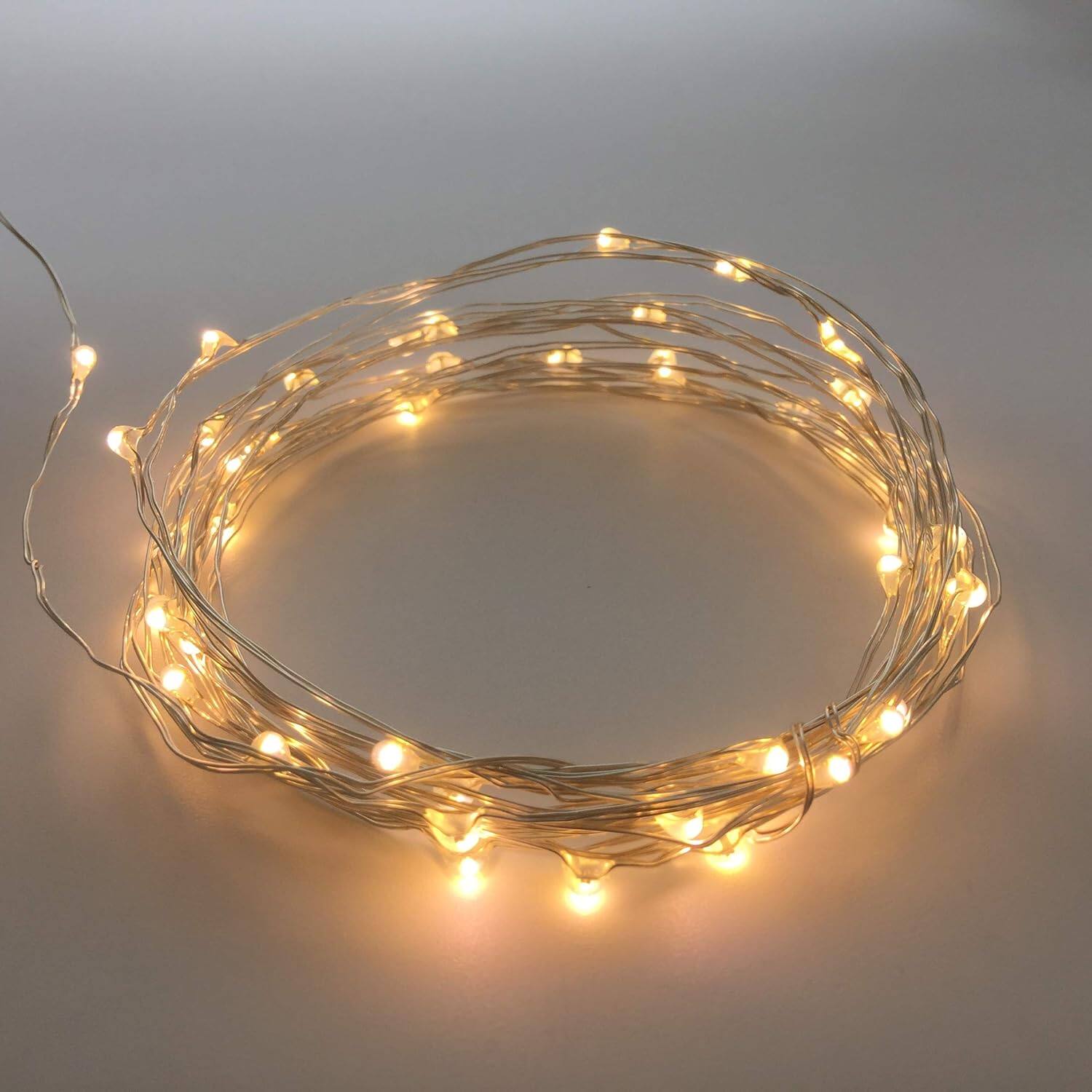 Left. THIRSTY TURTLE - 2pk Battery Mini LED Fairy Lights, 50 LEDs, 18ft Silver Wire, Warm White.