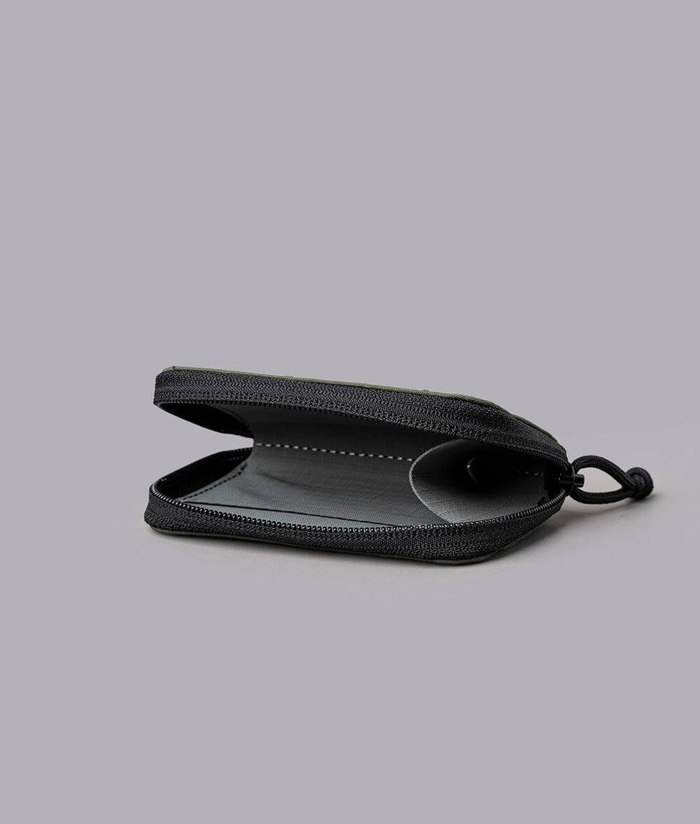 Left. ALPAKA - Zip Coin Wallet with RFID Protection, Water-Resistant Compact Card & Coin Holder - Green Axogrid 210D.