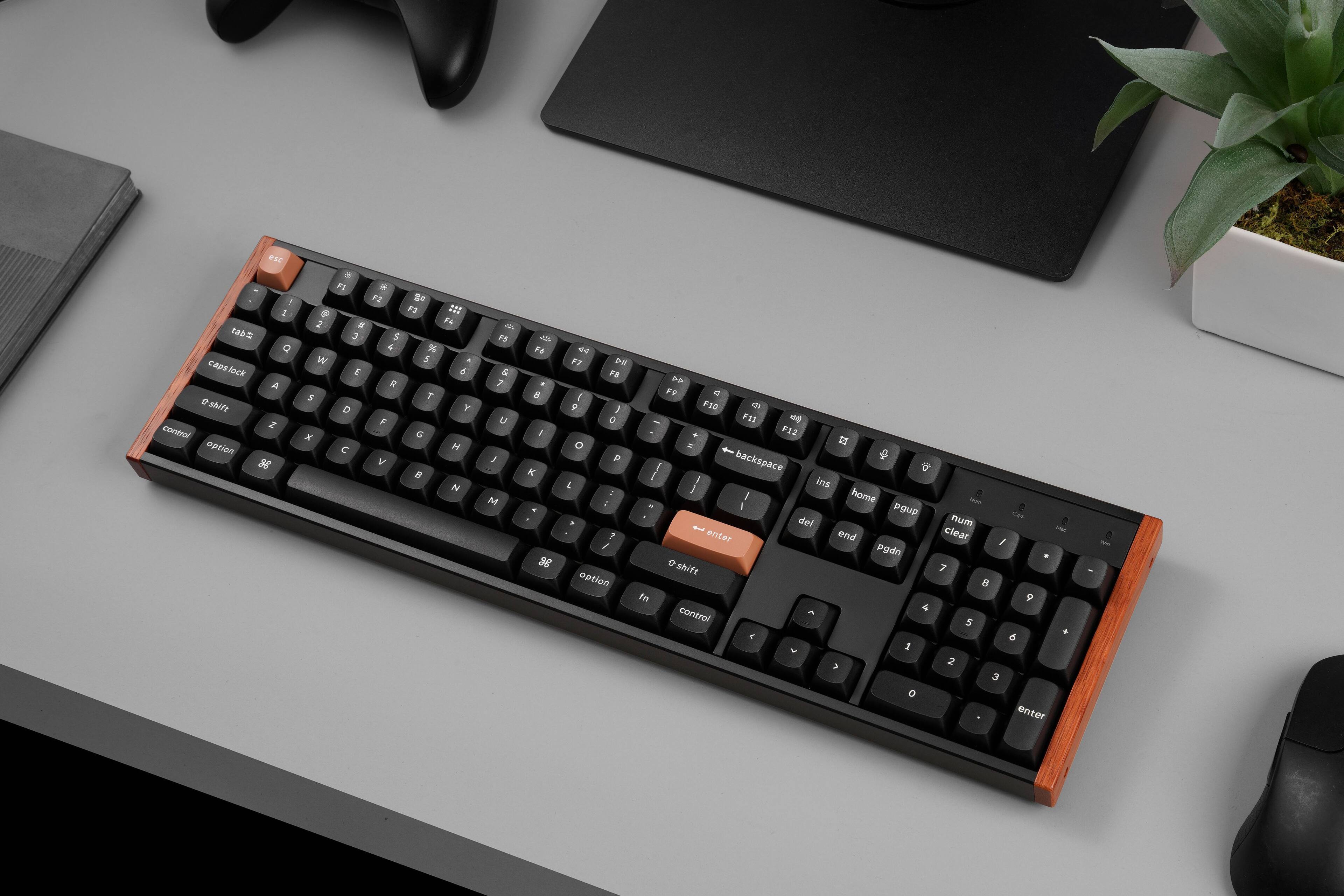 Here is the corrected and grouped text from the image:

- esc
- F1 F2 F3 F4 F5 F6 F7 F8 F9 F10 F11 F12
- 1 2 3 4 5 6 7 8 9 0 - =
- tab Q W E R T Y U I O P [ ] \
- caps lock A S D F G H J K L ; ' enter
- shift Z X C V B N M , . / shift
- control option space
- control option
- num clear / * - + enter
- 7 8 9 4 5 6 1 2 3 0 . enter