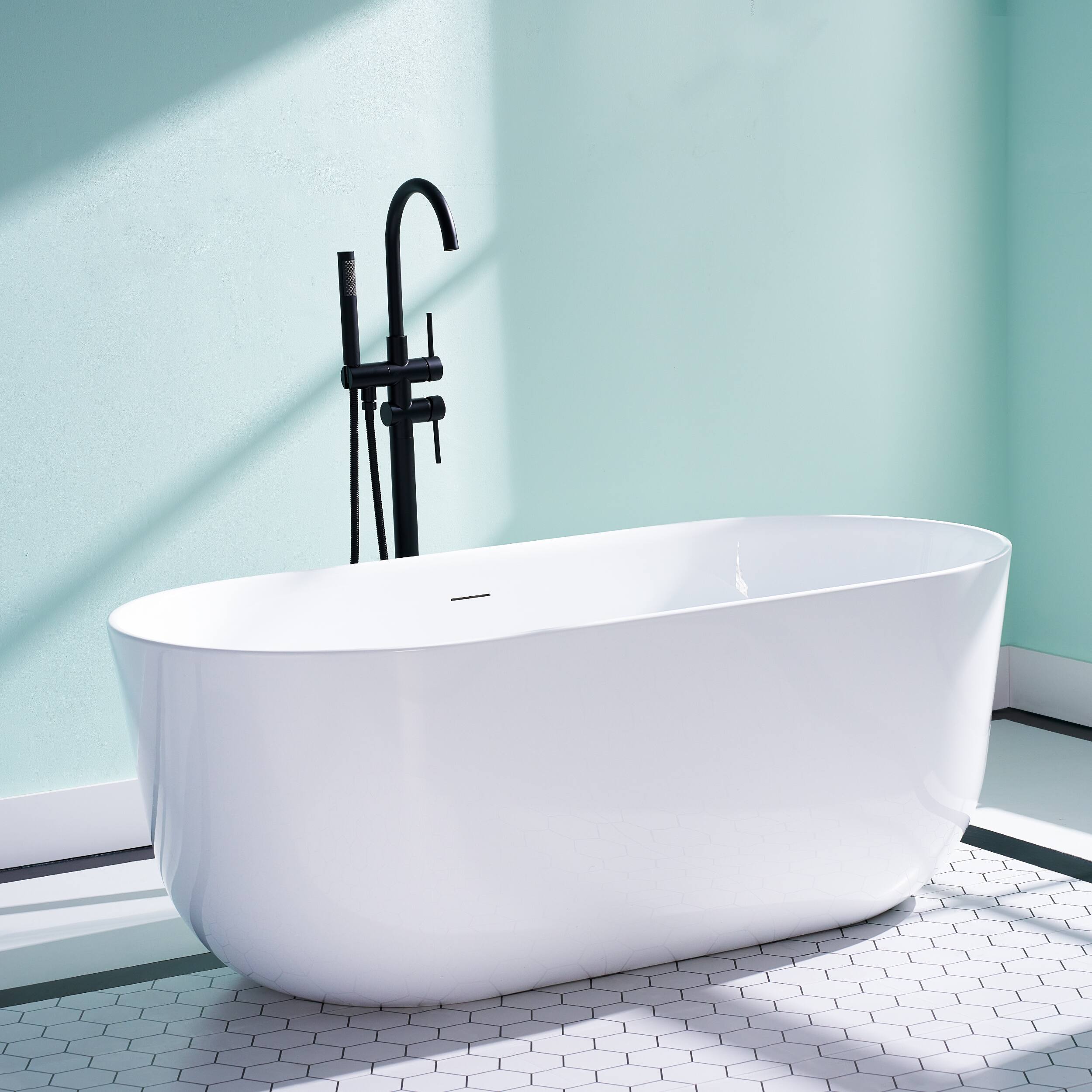 Angle. WELLFOR - Seren 59 in. x 28 in. Acrylic Oval Freestanding Soaking Bathtub with Center Pop-Up Drain and Overflow - White.