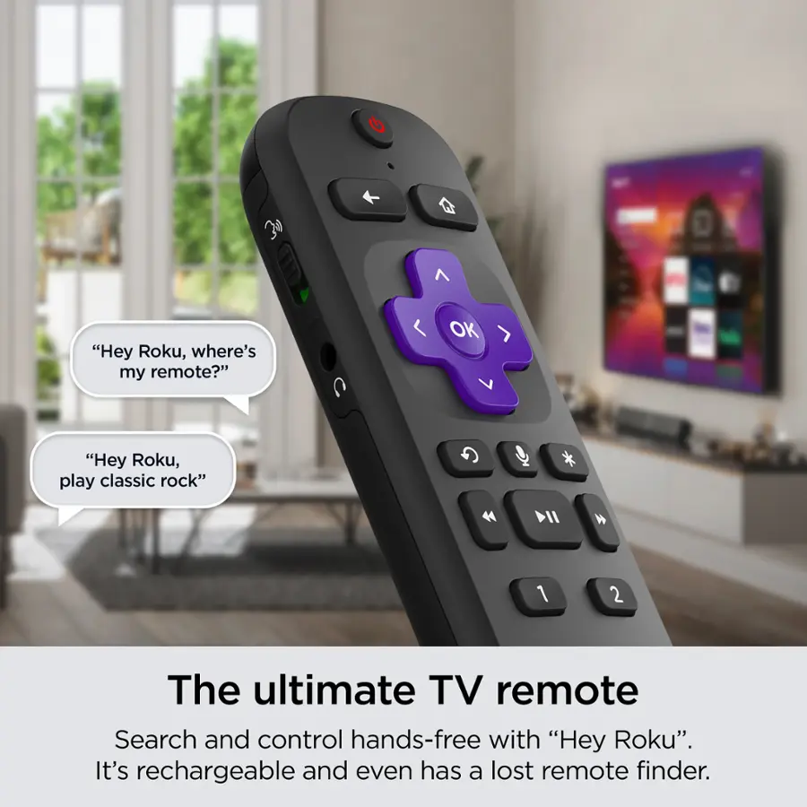 The ultimate TV remote is a hands-free device that allows users to search and control their TV using voice commands. It is rechargeable and even comes with a lost remote finder. The image shows a close-up of the remote control, which is purple and black in color. The remote is placed in front of a TV, and there is a potted plant nearby. The remote control is designed to work with Roku, a popular streaming device.