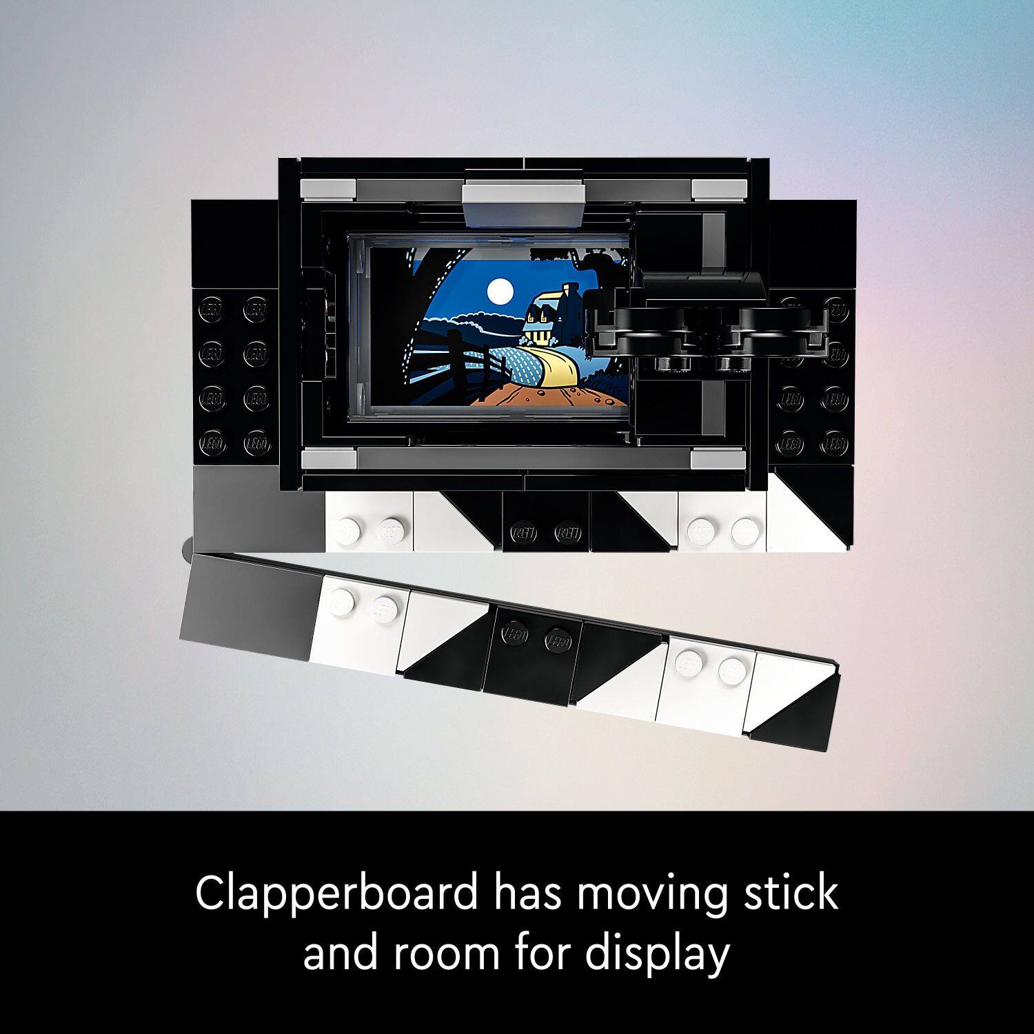 Clapperboard has moving stick and room for display.