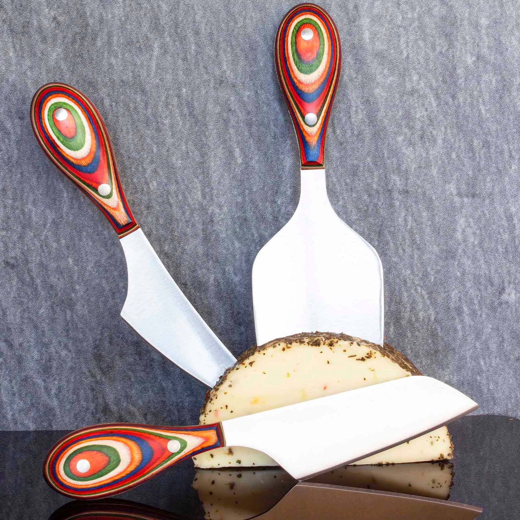 Left. Baltique - Marrakesh Collection 3-Piece Cheese Knife Set, Stainless Steel Cheese Knives with Colorful Wooden Handles - Red, Blue, Green, Orange.
