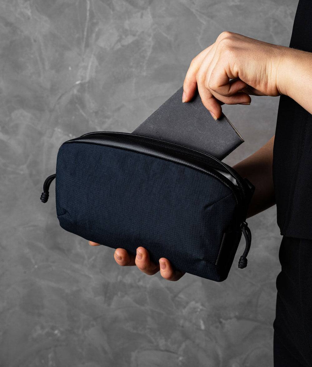 Left. ALPAKA - Flight Pouch Pro 0.7L Men's Carry-All & Organizer Clutches;Crossbody Bag for Men with RFID Blocking, Passport Holder - Moonlight Blue | Axoflux 400D Ripstop Nylon.