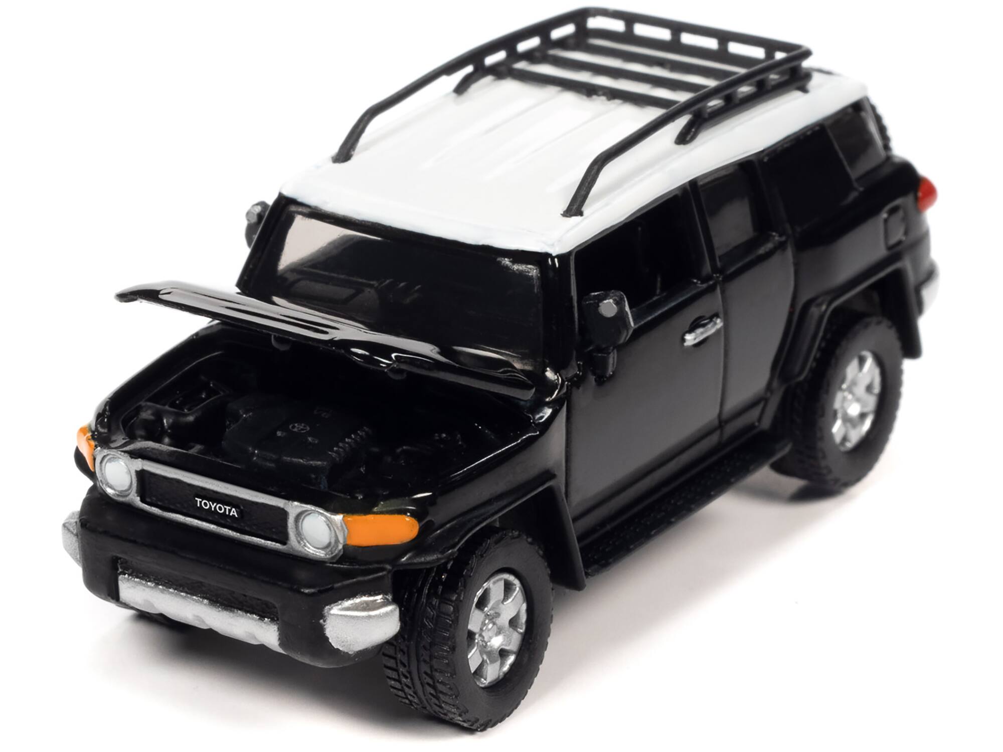 Angle. Johnny Lightning - 2007 Toyota FJ Cruiser Black Diamond with White Top and Roofrack "Classic Gold Collection" Series Limited Edition 1/64 - Black Diamond With White.