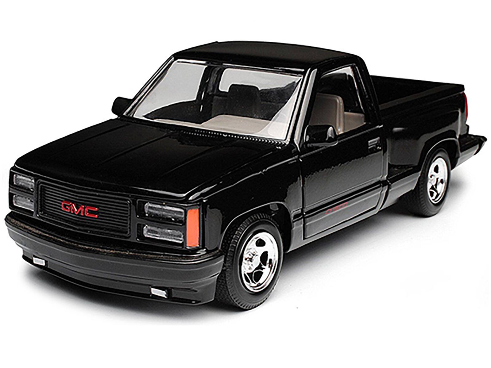Angle. Motormax - 1992 GMC Sierra GT Black Pickup Truck 1/24 Diecast Model by Motormax - Black.