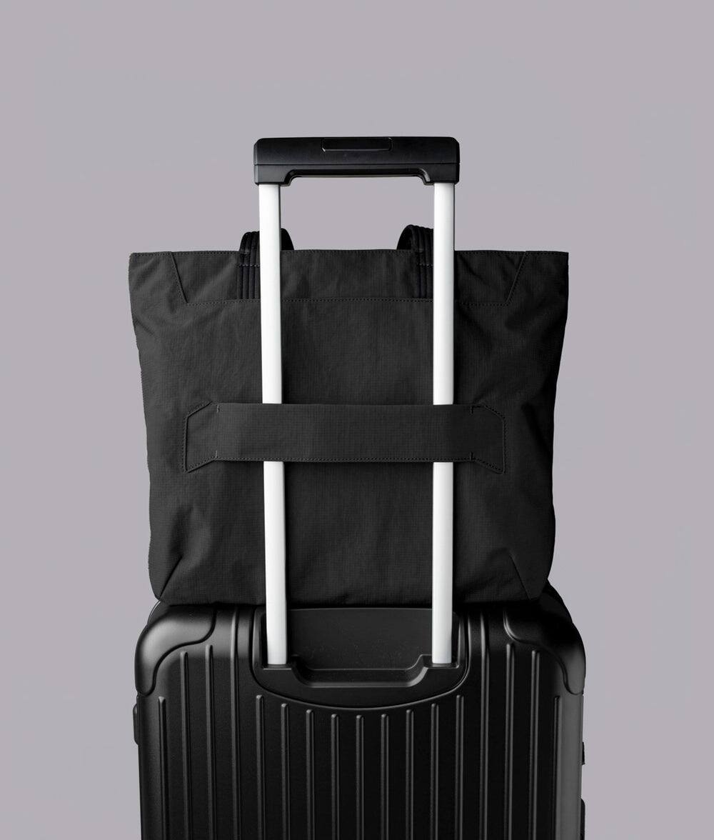 Alt View 9. ALPAKA - Flight Tote (M) Laptop Tote Bag for Work, Tote Bag Fits 14" MacBook Pro, Water Bottle Pocket, Luggage Pass-Through - Black Axoflux 400D.