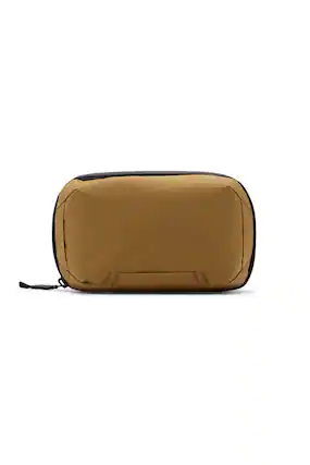 I am not sure what the text on the image is referring to, as it does not seem to be related to the image of a tan bag. The image shows a tan bag with a black strap, sitting on a white background.