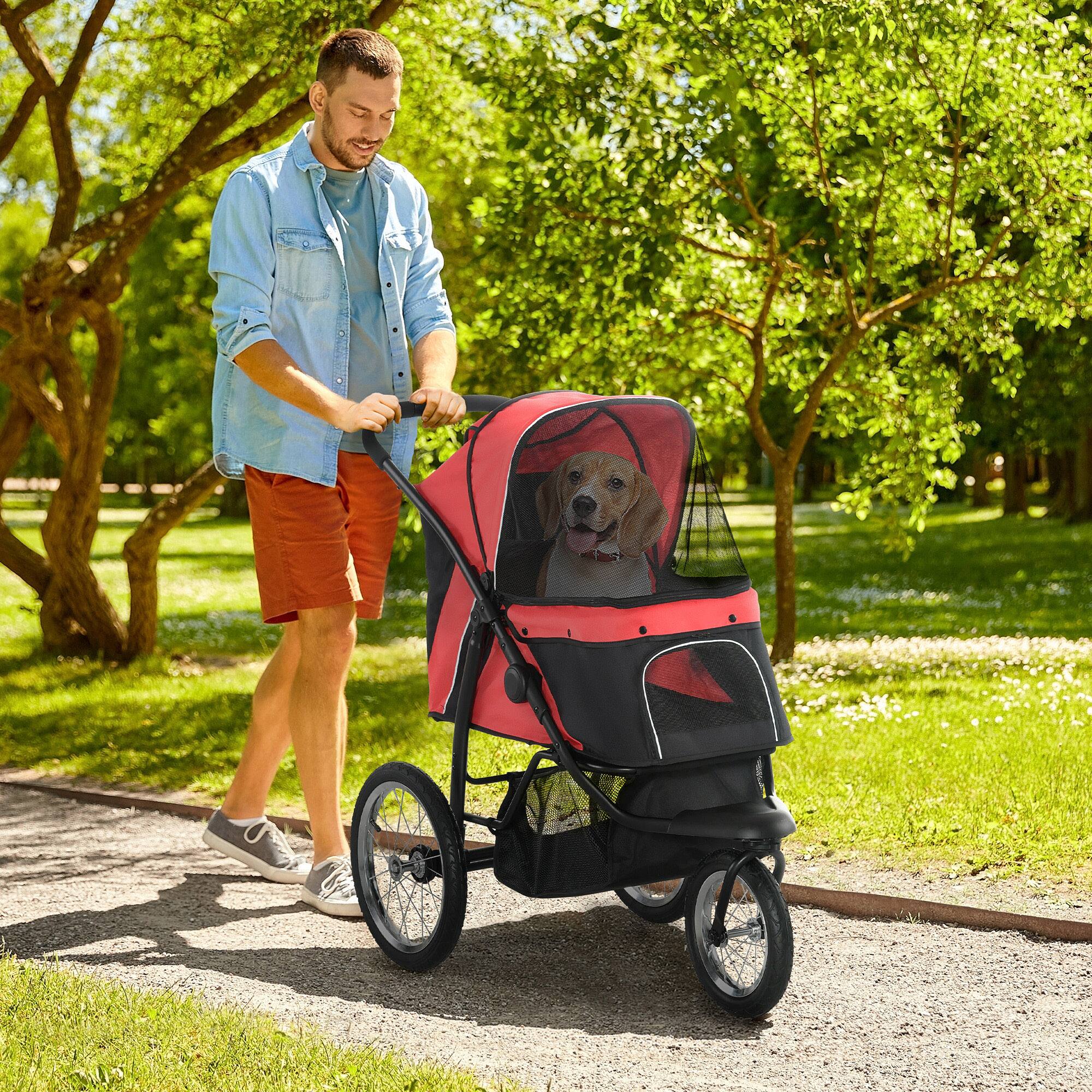 Angle. Pawhut - 3 Wheels Pet Stroller, Foldable Jogger, Adjustable Canopy, Safety Tether, Cushion, Basket.