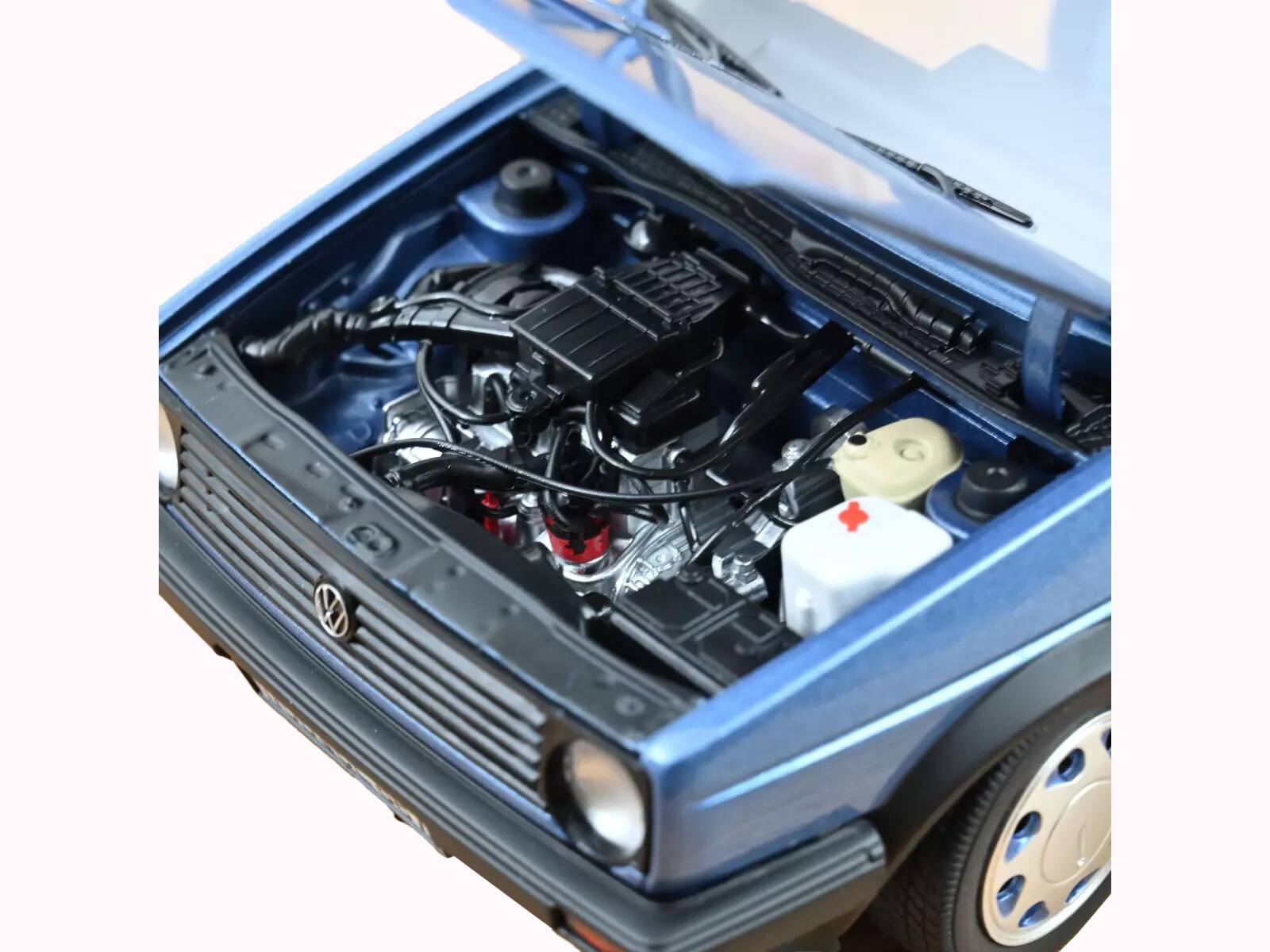 Left. Norev - 1988 Volkswagen Golf "10 Million" Star Blue Metallic 1/18 Diecast Model Car by Norev - Blue Metallic.