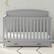 Angle. Graco - Benton 5-in-1 Convertible Crib with Drawer - Pebble Gray.