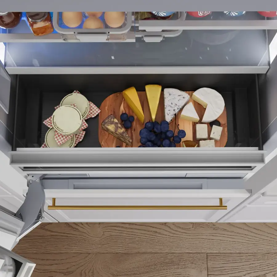 The text "POE IN EEINN" does not seem to be relevant to the image. The image shows a refrigerator with a drawer full of food items, including cheese, eggs, and other foods. The drawer is open, revealing the contents inside.