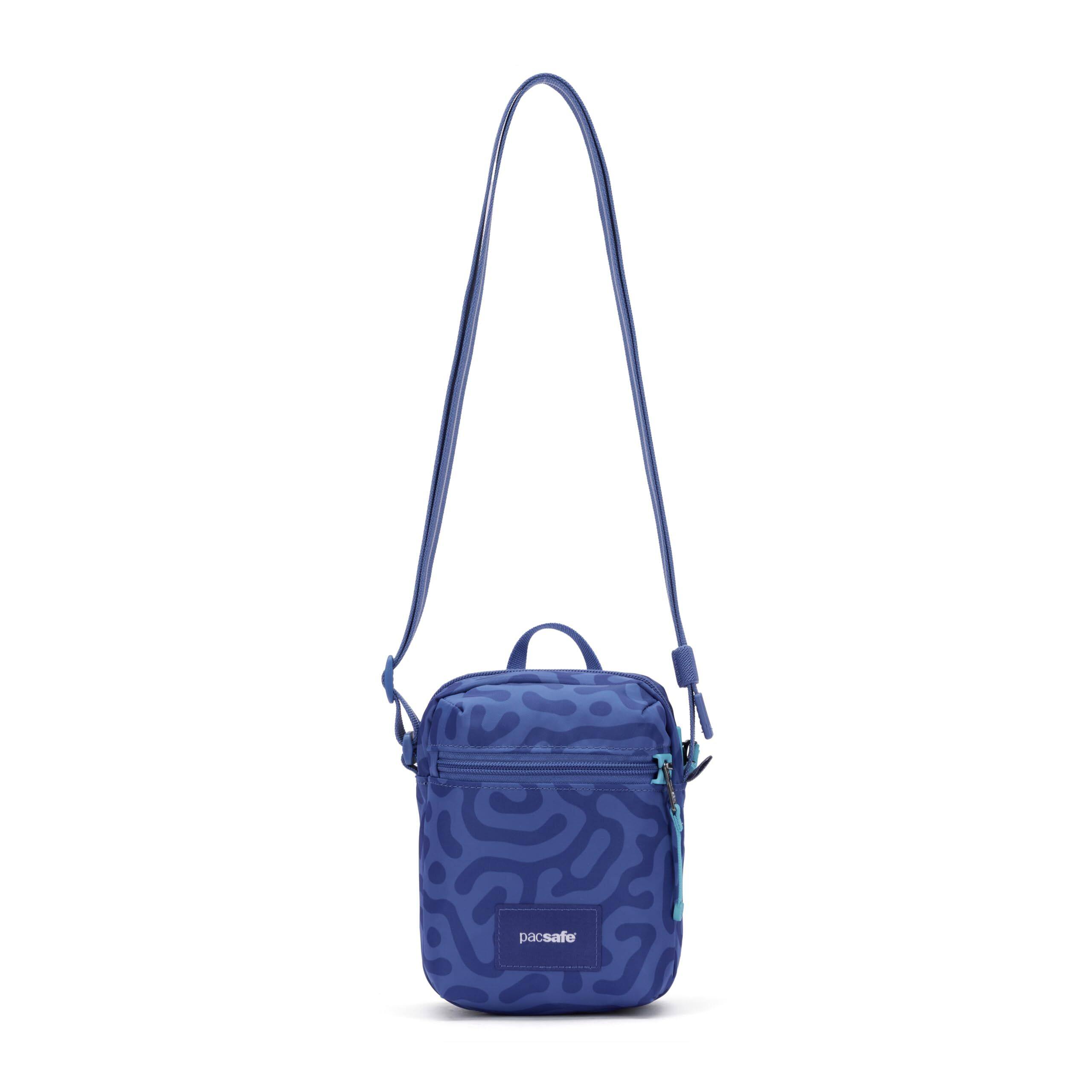 Angle. Pacsafe - GO Micro Crossbody - Cerulean Blue.