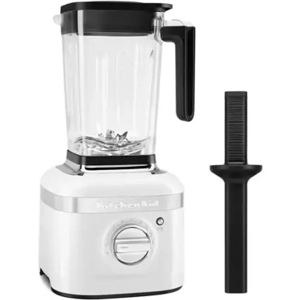 The image features a white KitchenAid blender with a black lid and a black handle. The blender is sitting on a counter, and a black blade is placed next to it. The blender is ready to be used, and it is a versatile appliance that can be used for various tasks in the kitchen.