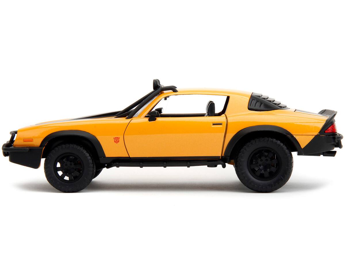 Left. Jada - 1977 Chevrolet Camaro Off-Road Bumblebee Yellow w/ Black Stripes & Transformers Statue – Rise of the Beasts (2023) 1/24 - Yellow Metallic with Black Stripes.
