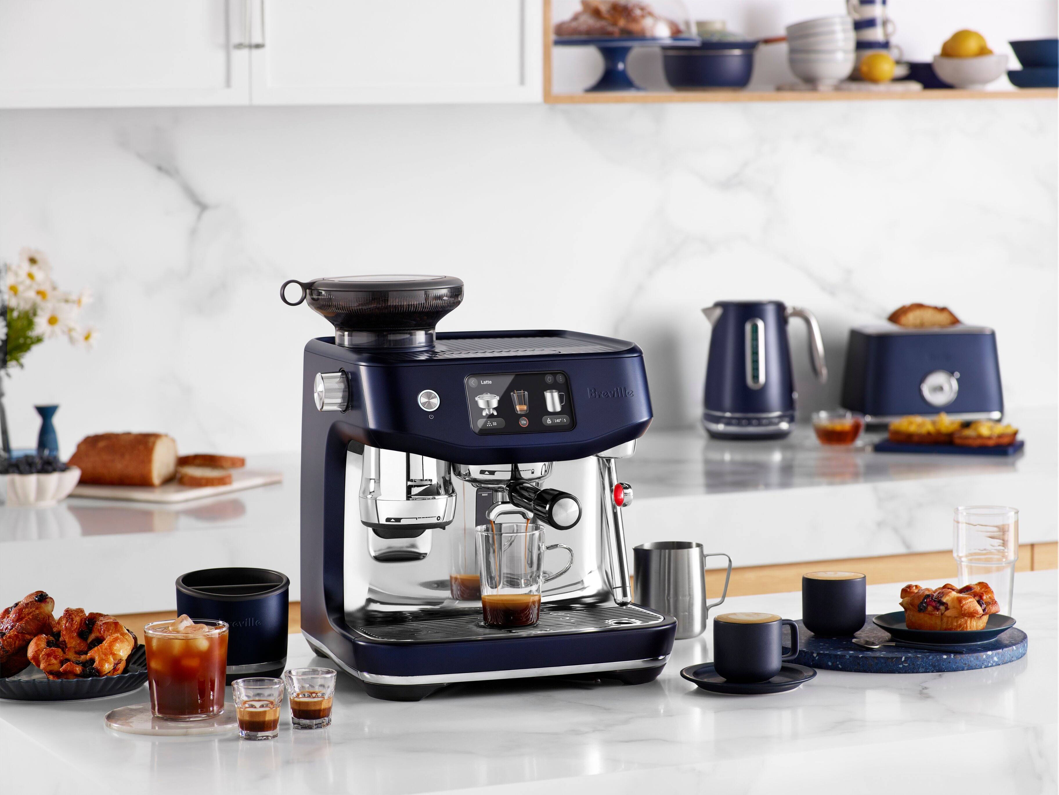 1. A blue coffee maker with a black lid.
2. A white and blue coffee maker.
3. A blue coffee maker on a counter.
4. A black coffee maker with a silver lid.
5. A coffee maker with a black lid.