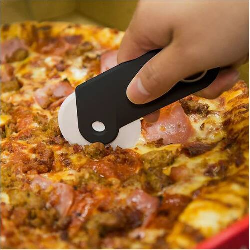 Left. Betty Crocker - Betty Crocker Pizza Maker Plastic Cutter with Bottle Opener.