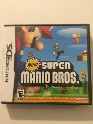 The text on the image is: "New Super Mario Bros. Everyone E Content Rating ESRB Nintendo." - E (Everyone)