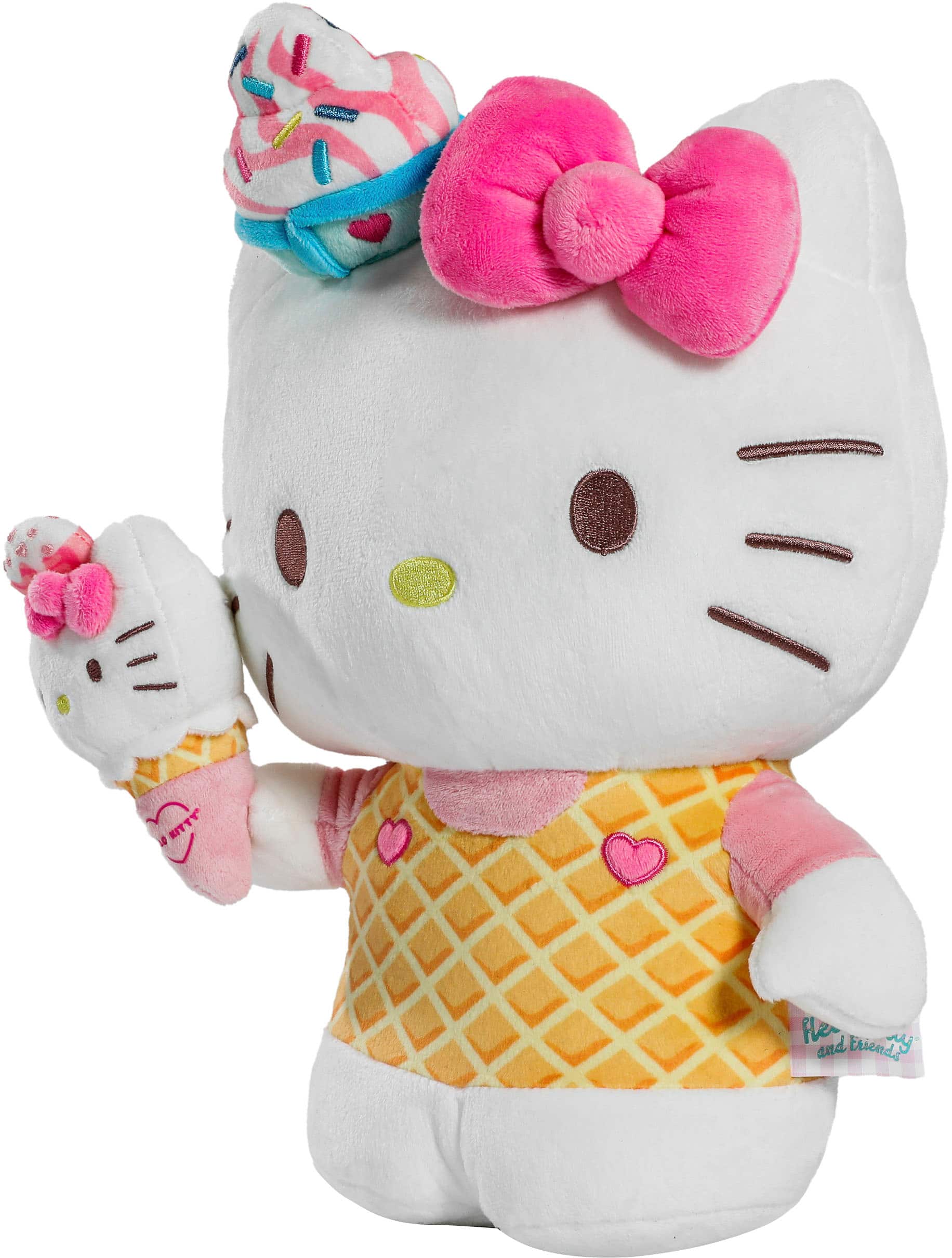 A KITTY doll is wearing a yellow dress and a pink bow.