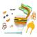 The image features a variety of toys and crafts, including a sandwich, a boat, and a hot dog. There are also several other items such as a rope, a ring, and a toothbrush. The toys and crafts are spread out on a white surface, making it easy to see and appreciate the different items.