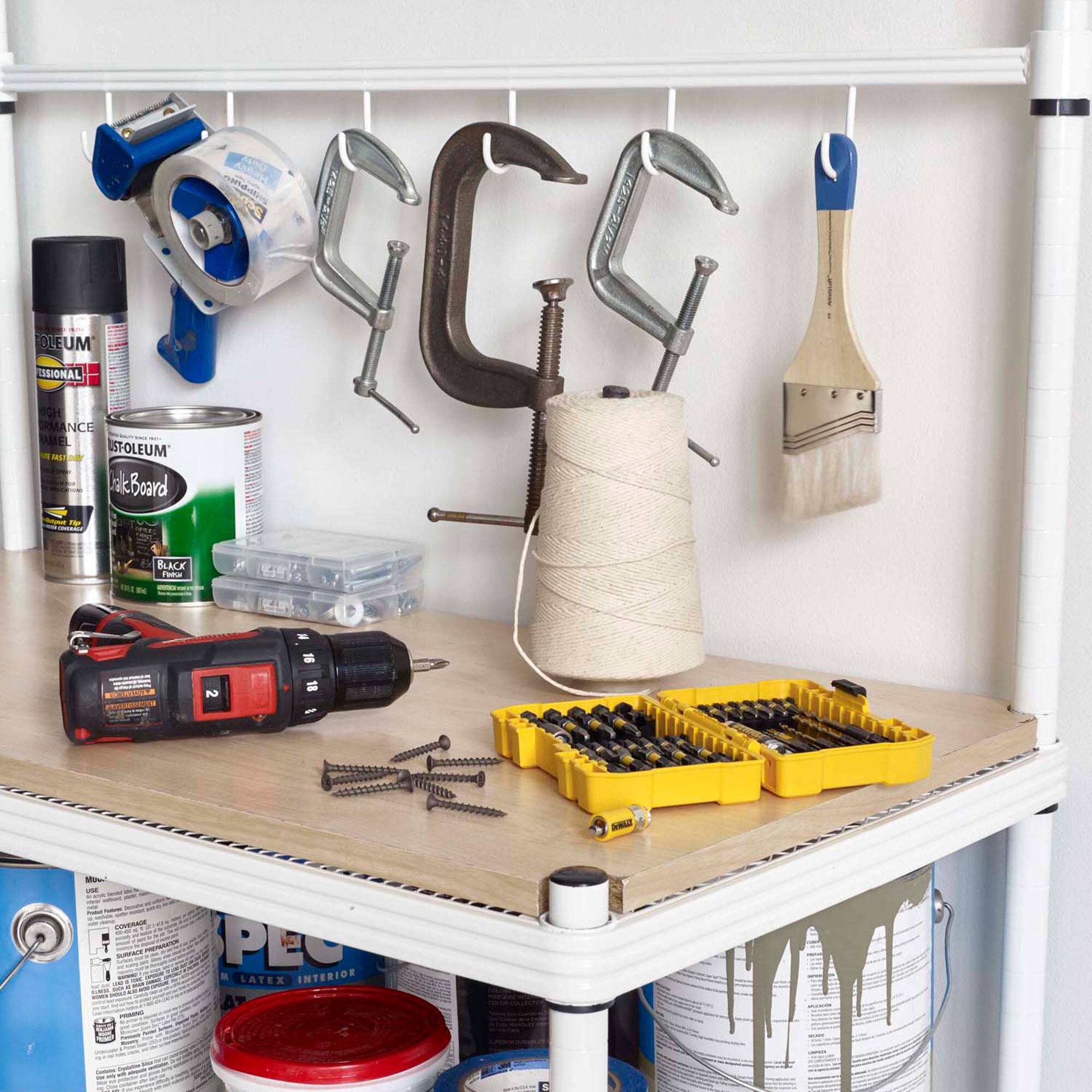 Sure, here is the corrected and grouped text from the image:

---

**Top Shelf:**

- **OUEUM**  
  **PROFESSIONAL**  
  **ADVANCE**  
  **MELT**  
  **BLACK**  
  **TATA**  
  **2**  
  **NE**  
  **PEC**  
  **LATEX INTERIOR**

- **OUEUM**  
  **BLACKBOARD**

- **BUCK**  
  **LATEX INTERIOR**

---

**Bottom Shelf:**

- **PEC**  
  **LATEX INTERIOR**

---

**Tools and Items:**

- **DEWALT**  
  **18V**  
  **XRP**  
  **20V MAX**  
  **LITHIUM-ION**  
  **BATTERY**

- **DEWALT**  
  **DRILL**

- **DEWALT**  
  **BIT SET**

- **DEWALT**  
  **SCREWDRIVER BITS**

- **DEWALT**  
  **DRILL BITS**

- **DEWALT**  
  **DRILL BITS**

- **DEWALT**  
  **DRILL BITS**

- **