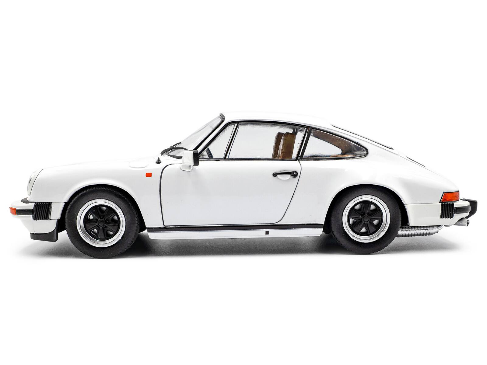 Left. Solido - 1974 Porsche 911 (930) 3.0 SC Grand Prix White 1/18 Diecast Model Car by Solido - White.