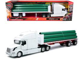 Volvo VN-780 Truck with Flatbed Trailer and Long Pipes "Long Haul Truckers" Series 1/32 Diecast Model by New Ray - White