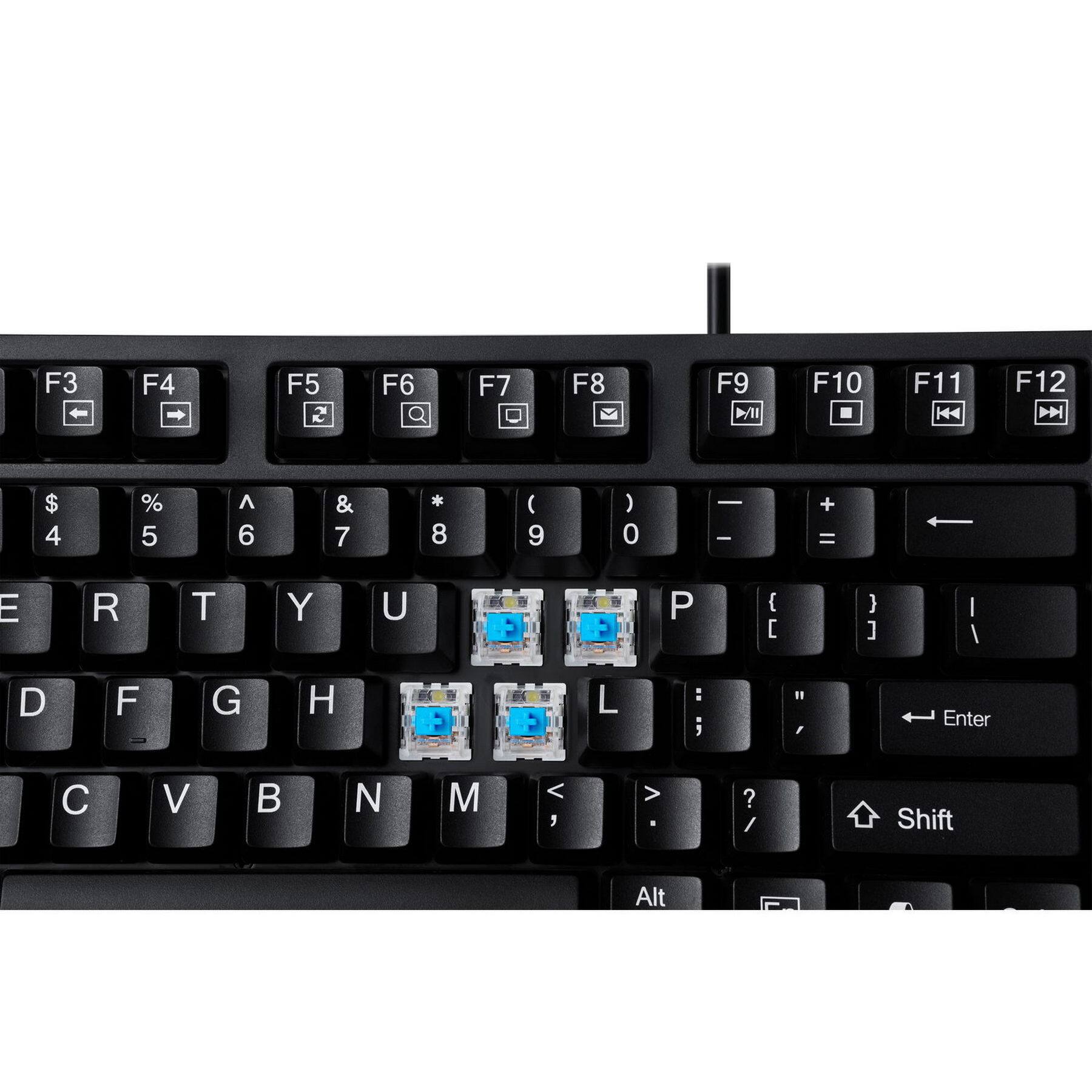 The image shows a close-up of a black keyboard with a few blue stickers on it. The stickers are placed on the letters "E" and "R" and the numbers "2" and "8". The keyboard also has a "Shift" button on the right side.