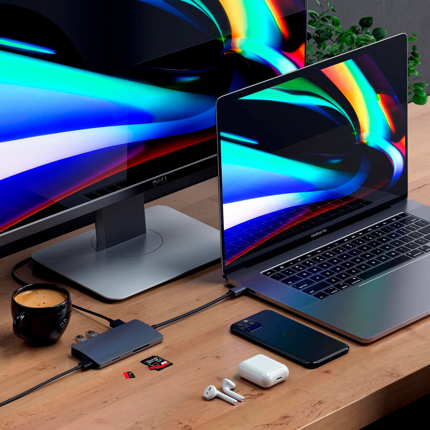 "Notebook, cell phone, and charger on a wooden desk."