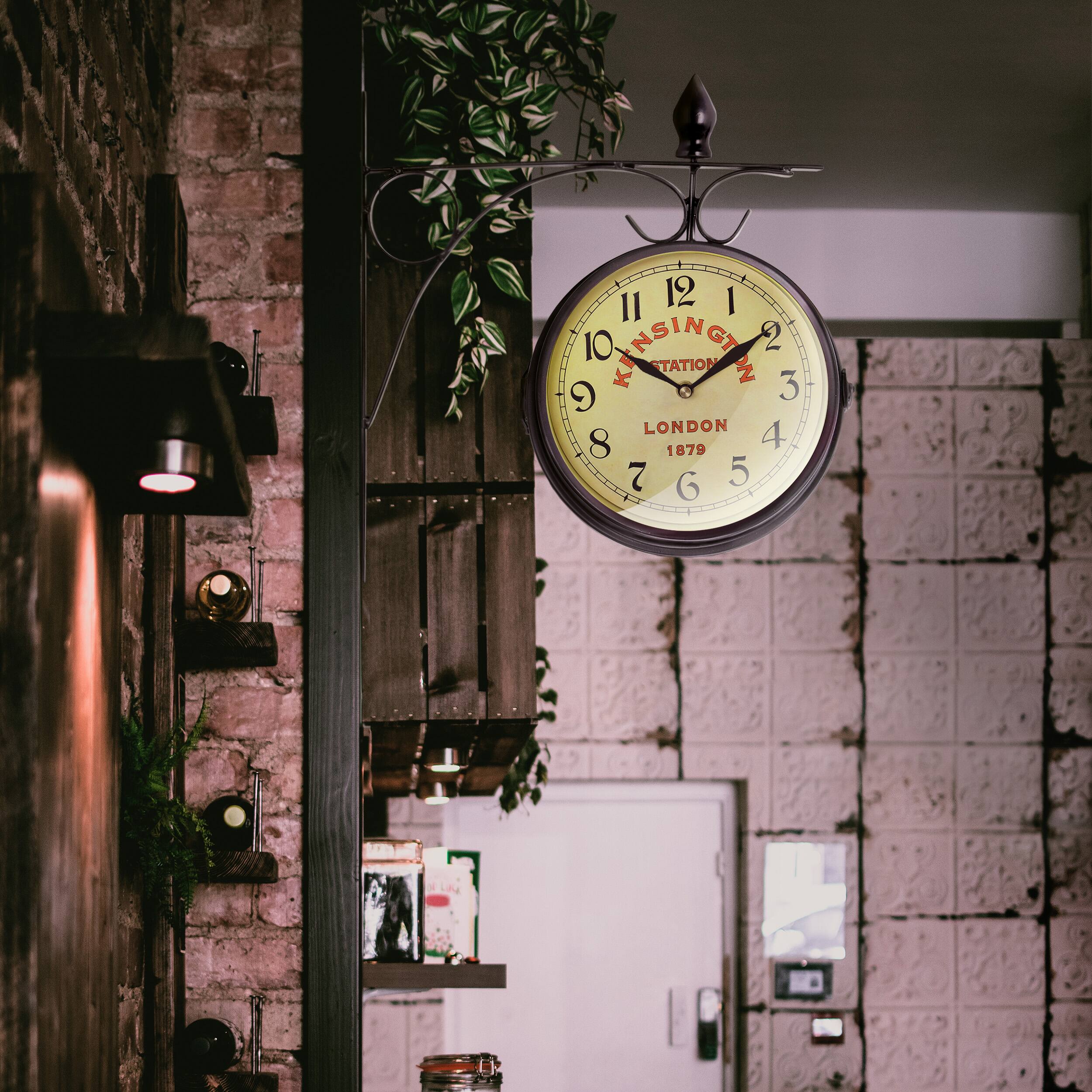 The text on the clock reads:

"KINSINGTON STATION  
LONDON  
1879"
