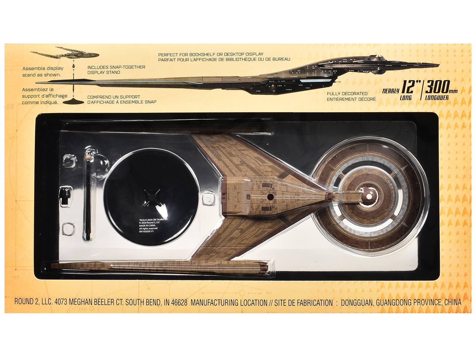 Assemble display stand as shown.  
Assemblez le support d'affichage comme indiqué.  

PERFECT FOR BOOKSHELF OR DESKTOP DISPLAY  
PARFAIT POUR L'AFFICHAGE DE BIBLIOTHÈQUE OU DE BUREAU  

INCLUDES SNAP-TOGETHER DISPLAY STAND  
COMPREND UN SUPPORT D'AFFICHAGE À ENSEMBLE SNAP  

NEARLY 12" 300 mm FULLY DECORATED  
ENTIÈREMENT DÉCORÉ LONGUEUR  

ROUND 2, LLC. 4073 MEGHAN BEELER CT. SOUTH BEND, IN 46628  
MANUFACTURING LOCATION // SITE DE FABRICATION : DONGGUAN, GUANGDONG PROVINCE, CHINA