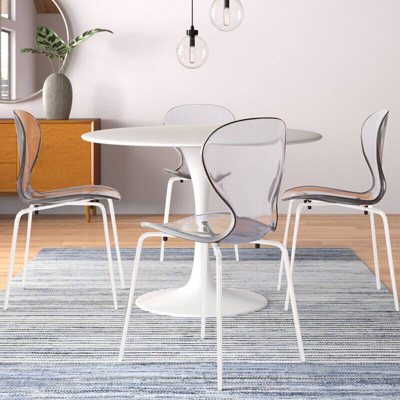 Angle. LeisureMod - Oyster Modern Clear Plastic Dining Chair, Stackable Ergonomic Accent Chair with Powder Coated Steel Legs - Clear.