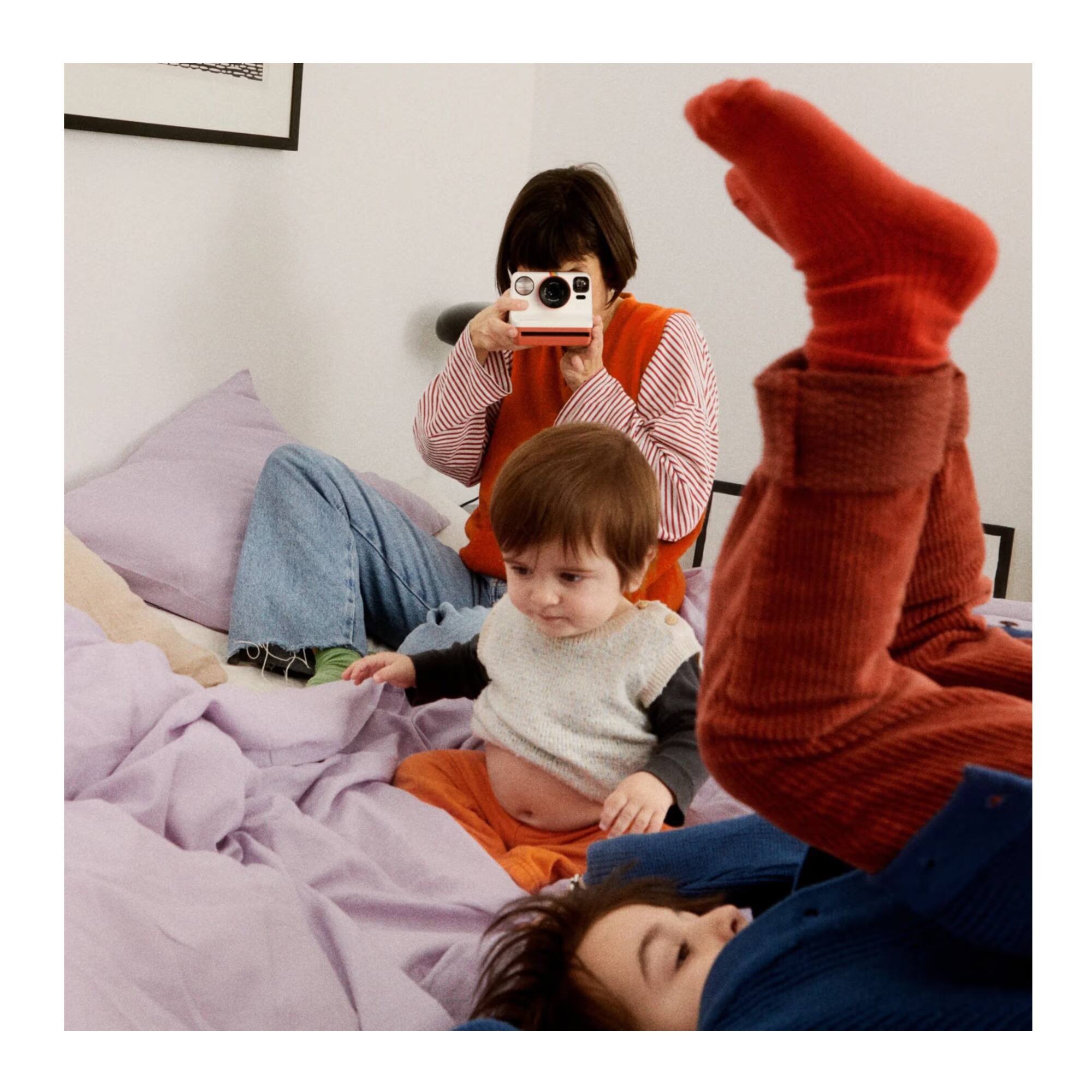 Left. Polaroid Originals - Now Generation 3 MoMa Edition with Self-Timer and Autofocus Lens.