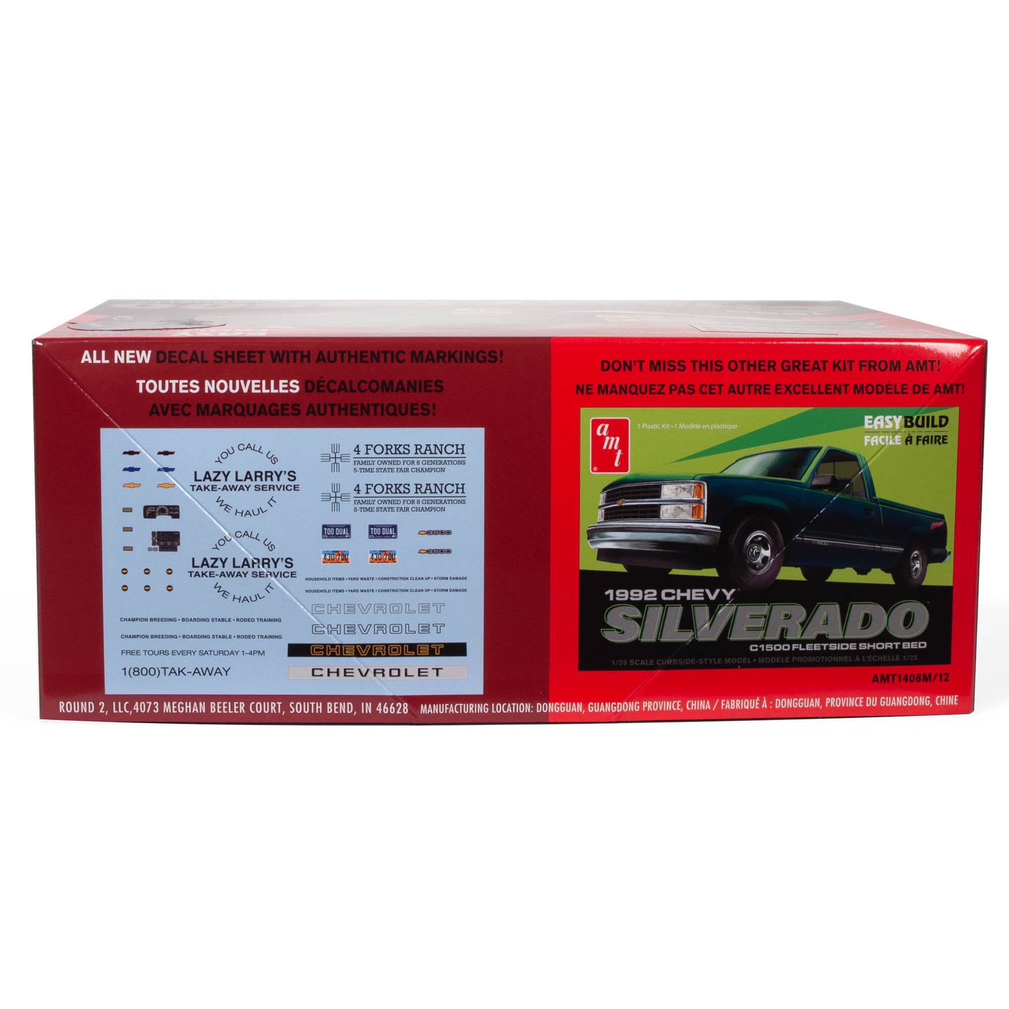The image features a red box with a blue decal sheet inside. The box is labeled "All New Decal Sheet with Authentic Markings," and the decal sheet is advertised as being from AMT. The box also contains a green truck decal, and the text on the image suggests that it is a kit for building a 1992 Chevy Silverado. The box is made in China and distributed by Round 2 LLC in South Bend, Indiana.