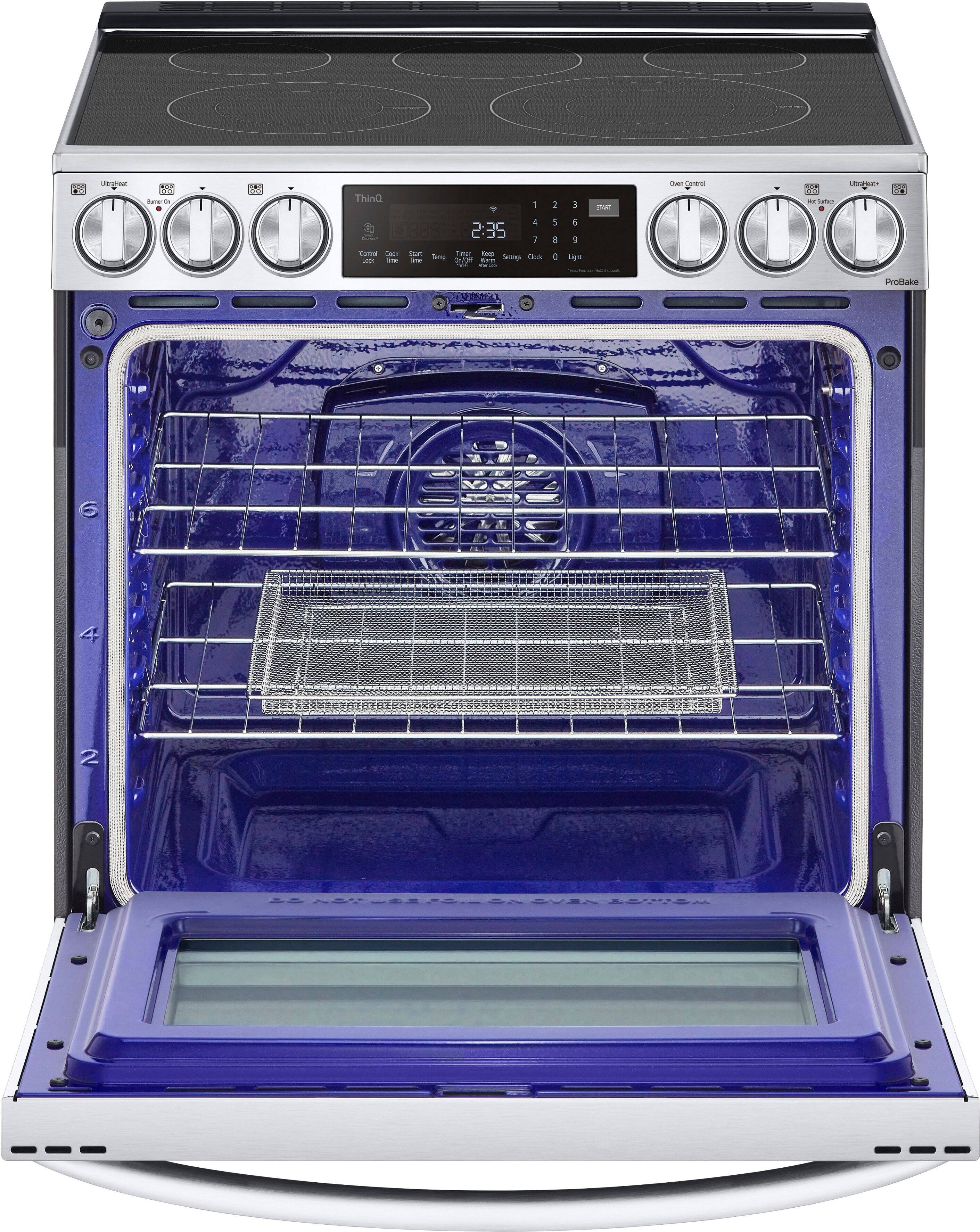 The oven is blue and has a digital display on the front. The display shows that the oven is set to 2:35. The oven is empty, with no food inside.