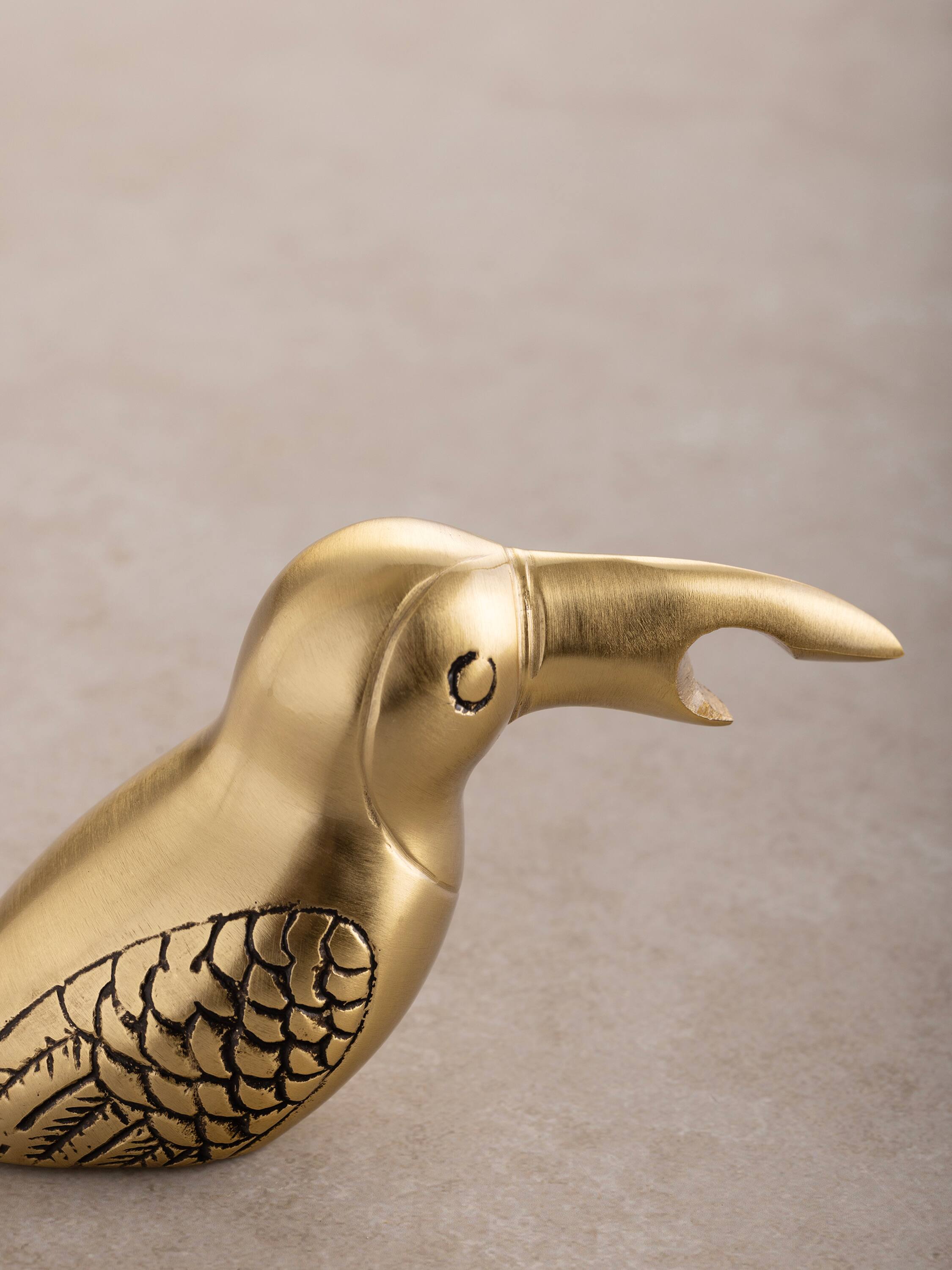 Left. GAURI KOHLI - Goldie Bottle Opener - Antique matte gold.