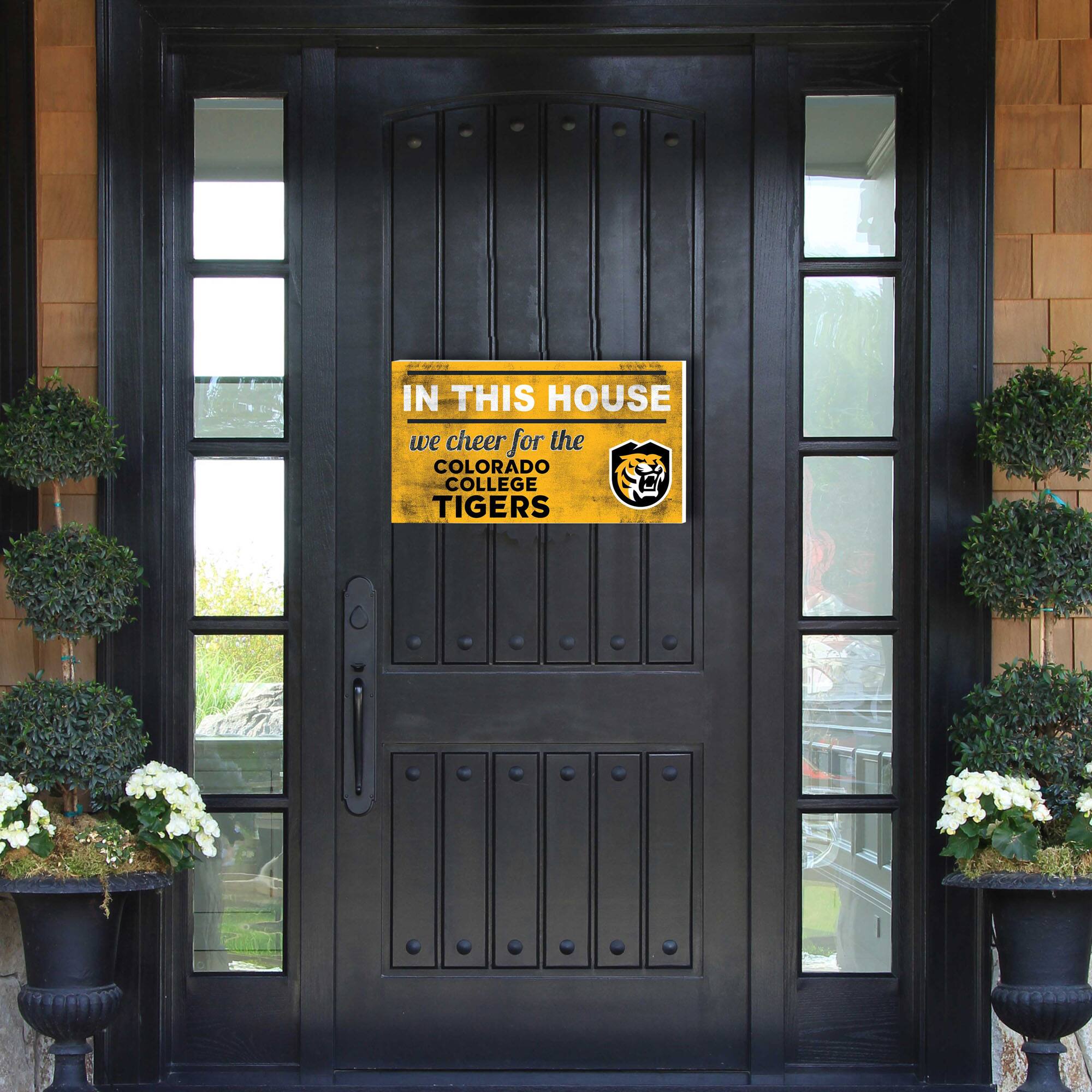 IN THIS HOUSE  
we cheer for the  
COLORADO COLLEGE TIGERS