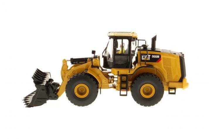 Left. Diecast Masters - CAT Caterpillar 966M Wheel Loader with Operator "Core Classics Series" 1/50 Diecast Model  by Diecast Masters - Yellow and Black.