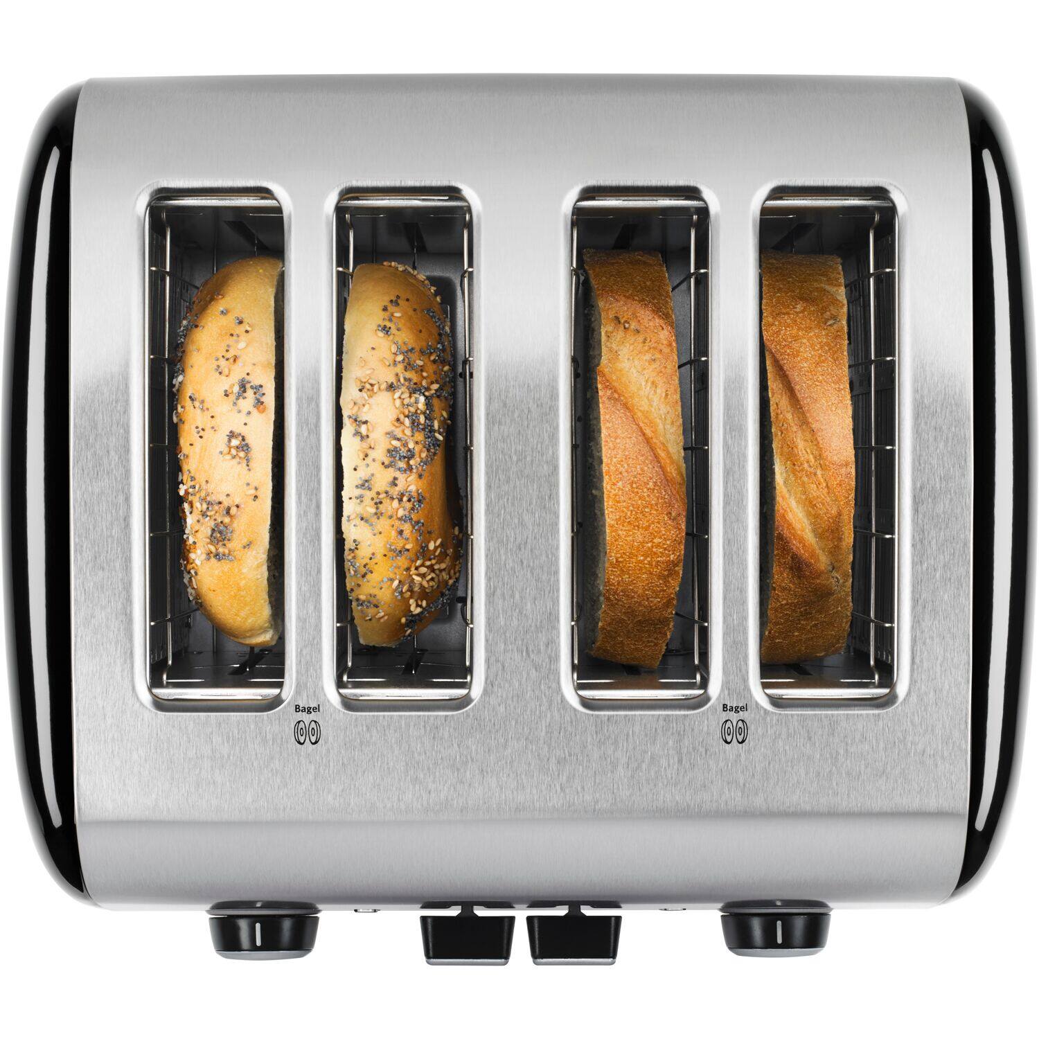 The image shows a silver toaster with two bagels inside. The toaster is open, revealing the bagels. The bagels are placed on the toaster's heating elements, which are designed to toast the bread. The toaster is likely being used to prepare a breakfast or snack, providing a warm and crispy texture to the bagels.